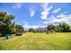 Huge backyard featuring a utility shed, horse pen, and lush lawn, offering plenty of outdoor space at 3730 Ralston Rd, Plant City, FL 33566