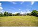 Spacious backyard features a well-maintained lawn and mature trees at 3730 Ralston Rd, Plant City, FL 33566