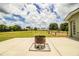 Large backyard with a metal fire pit and fenced area at 3730 Ralston Rd, Plant City, FL 33566