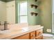 Bathroom featuring a vanity with storage and decorative shelves at 3730 Ralston Rd, Plant City, FL 33566