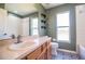 Bathroom featuring a vanity, patterned floors, and a walk-in shower at 3730 Ralston Rd, Plant City, FL 33566