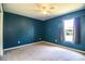 Bedroom with blue walls, carpet floors, and a ceiling fan at 3730 Ralston Rd, Plant City, FL 33566