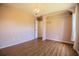 Cozy bedroom with hardwood floors and a decorative chandelier at 3730 Ralston Rd, Plant City, FL 33566