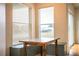 Inviting breakfast nook featuring large windows and built in bench seating and storage at 3730 Ralston Rd, Plant City, FL 33566