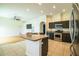 Modern kitchen with a large island, stainless steel appliances, and dark wood cabinets at 3730 Ralston Rd, Plant City, FL 33566