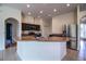 Modern kitchen with a large island, stainless steel appliances, and dark wood cabinets at 3730 Ralston Rd, Plant City, FL 33566