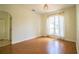 Bright living room with beautiful hard wood floors and an arched window at 3730 Ralston Rd, Plant City, FL 33566