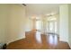 Bright living room with beautiful hard wood floors and ample natural light at 3730 Ralston Rd, Plant City, FL 33566