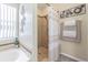 This bathroom includes a tub, a shower and hard floors at 4223 Amber Ridge Ln, Valrico, FL 33594