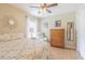 This bedroom features a ceiling fan, hardwood floors, a bed and a dresser at 4223 Amber Ridge Ln, Valrico, FL 33594