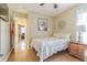 This bedroom features a comfortable bed, hardwood floors and a ceiling fan at 4223 Amber Ridge Ln, Valrico, FL 33594