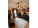 Personal cave bedroom featuring fan, media, sports theme decor, providing a relaxing and entertaining space at 4223 Amber Ridge Ln, Valrico, FL 33594