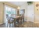 This dining room includes a door to the backyard, a chandelier and a table at 4223 Amber Ridge Ln, Valrico, FL 33594