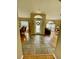 Inviting foyer with tile flooring, leading to hardwood floors and spacious living areas with lots of natural light at 4223 Amber Ridge Ln, Valrico, FL 33594