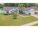Charming home boasting a lush front lawn with manicured landscaping and an inviting walkway at 4223 Amber Ridge Ln, Valrico, FL 33594