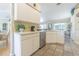 This bright kitchen includes a dishwasher and white cabinets at 4223 Amber Ridge Ln, Valrico, FL 33594