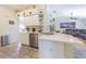 This kitchen includes a dishwasher, white cabinets, and a island at 4223 Amber Ridge Ln, Valrico, FL 33594