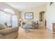 Comfortable living room showcasing hardwood floors, vaulted ceilings, and arched windows with lots of natural light at 4223 Amber Ridge Ln, Valrico, FL 33594