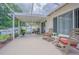 Enjoy this inviting screened patio, with cozy seating, perfect for outdoor relaxation and gatherings, plus lush landscaping at 4223 Amber Ridge Ln, Valrico, FL 33594