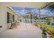 Spacious screened patio offers scenic views of the pool and backyard, ideal for outdoor entertaining and relaxation at 4223 Amber Ridge Ln, Valrico, FL 33594