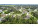Extensive aerial view of a residential neighborhood displaying lush greenery and homes on spacious lots at 4592 Crabapple Ave, North Port, FL 34287