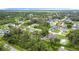 This aerial view showcases a community of beautiful homes surrounded by lush landscapes at 4592 Crabapple Ave, North Port, FL 34287