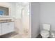 A beautifully remodeled bathroom featuring a glass shower and updated sink at 4592 Crabapple Ave, North Port, FL 34287