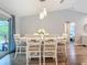 Dining room with decorative lighting, wood floors, and sliding glass doors to backyard at 4592 Crabapple Ave, North Port, FL 34287