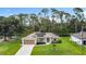 Charming single-Gathering home with a manicured lawn, solar panels, and a two-car garage at 4592 Crabapple Ave, North Port, FL 34287
