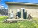 This outside shot displays a water filtration and water softener system on a concrete slab at 4592 Crabapple Ave, North Port, FL 34287