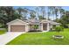 Charming single-story home with a well-maintained lawn and solar panels, enhancing its curb appeal at 4592 Crabapple Ave, North Port, FL 34287