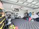 An open garage with a variety of items for storage or yard work at 4592 Crabapple Ave, North Port, FL 34287