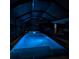 Night view of the screened pool with bright blue lights creating a relaxing ambiance at 4592 Crabapple Ave, North Port, FL 34287