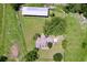 Aerial view of a charming home, large barn, and lush green acreage at 4611 Executive Meadows Dr, Plant City, FL 33567