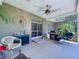 Covered back porch with an outdoor kitchen and seating area at 4611 Executive Meadows Dr, Plant City, FL 33567