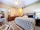 Bright bedroom boasts vaulted ceilings, neutral walls, and classic area rug at 4611 Executive Meadows Dr, Plant City, FL 33567