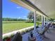 Spacious front porch with a view of fenced acreage at 4611 Executive Meadows Dr, Plant City, FL 33567