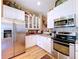 Modern kitchen boasts stainless steel refrigerator and plentiful cabinet space at 4611 Executive Meadows Dr, Plant City, FL 33567