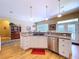 Kitchen area features stainless steel appliances, wood flooring, and granite countertops at 4611 Executive Meadows Dr, Plant City, FL 33567