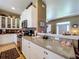 Bright kitchen with stainless steel appliances, granite countertops, and ample cabinet space at 4611 Executive Meadows Dr, Plant City, FL 33567