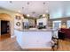Bright kitchen with white cabinets, stainless steel appliances, and an island with breakfast bar at 4611 Executive Meadows Dr, Plant City, FL 33567