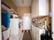 Functional laundry room with washer, dryer, storage cabinets and tile floors at 4611 Executive Meadows Dr, Plant City, FL 33567