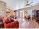 Bright living room with hardwood floors, a brick fireplace, and large windows at 4611 Executive Meadows Dr, Plant City, FL 33567