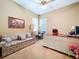 Comfortable home office with ceiling fan, desk and sofa at 4611 Executive Meadows Dr, Plant City, FL 33567