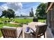 Cozy backyard patio with comfortable seating, a barbecue grill, and a lush lawn at 4616 Edwards Rd, Plant City, FL 33567