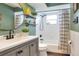 Stylish bathroom with modern vanity, sleek fixtures, and a shower tub combination at 4616 Edwards Rd, Plant City, FL 33567