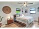 Comfortable bedroom featuring a ceiling fan, modern decor, and plenty of natural light at 4616 Edwards Rd, Plant City, FL 33567