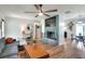 Stylish living room with a modern fireplace, open layout, and beautiful hardwood floors at 4616 Edwards Rd, Plant City, FL 33567
