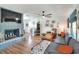 Spacious living room with a cozy fireplace, modern decor, and a comfortable seating area at 4616 Edwards Rd, Plant City, FL 33567