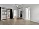 Primary bedroom with lots of natural light, wood floors, and ensuite bathroom at 8050 Eacon Ct, Hudson, FL 34667